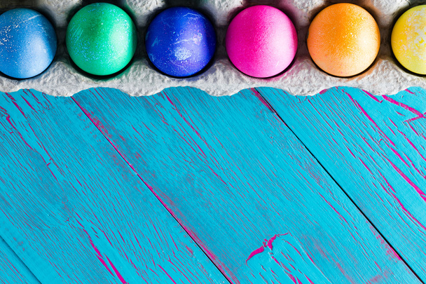 Colorful Easter egg frame on exotic blue copyspace - Фото, зображення