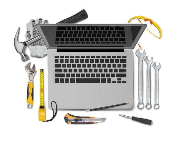 Open laptop with tools isolated on white background. Symbol of repair, upgrade and improvement - 写真・画像