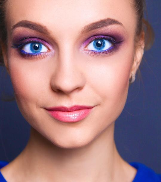 Studio shot of a beautiful young woman wearing professional makeup - Photo, image