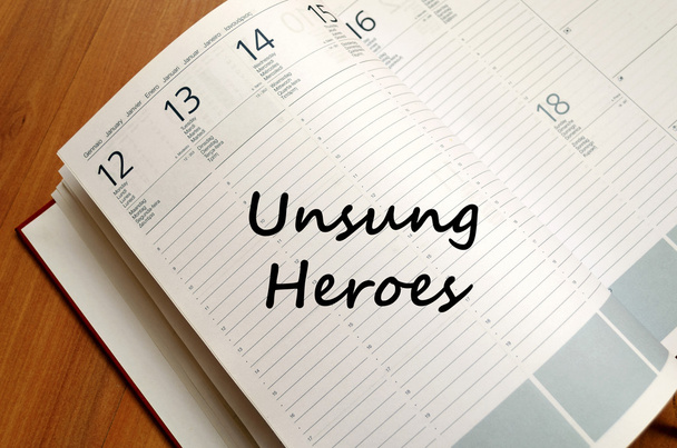Unsung heroes write on notebook - Photo, Image
