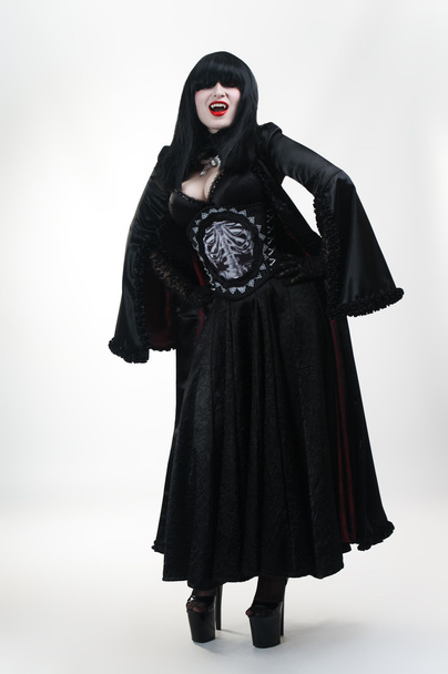Medieval vampire girl in black dress on white - Zdjęcie, obraz