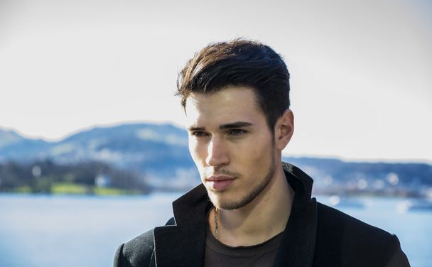 Handsome young man on Luzern lakes shore - Foto, Imagen