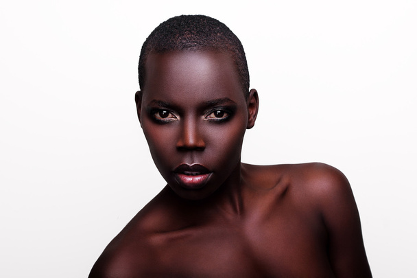 Black African young sexy fashion model studio portrait isolated white black - Photo, Image