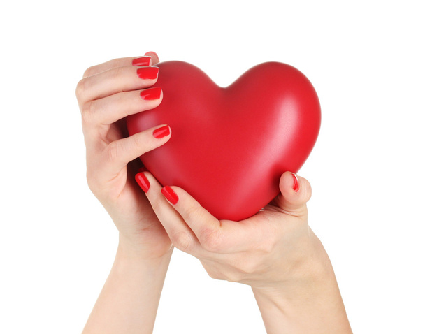 Красное сердце в руках женщины изолированы на белом
 - Фото, изображение