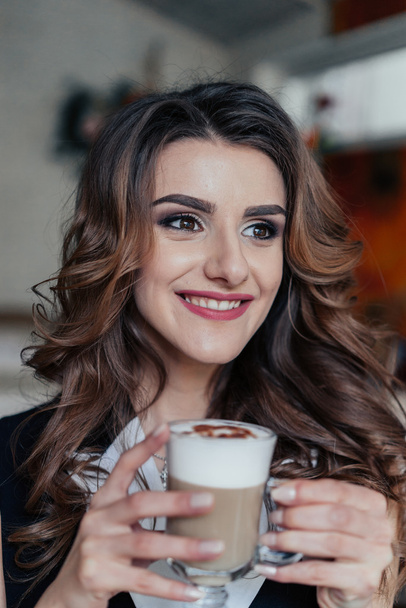 Business lady in cafe drinking latte - Photo, Image