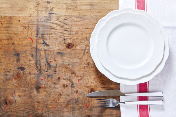 empty plate with cutlery on a wooden background. space for writi - Photo, Image