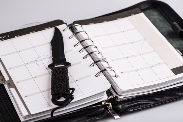 murder planning concept - calendar and knife - Photo, Image