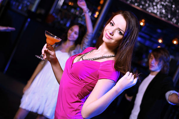 Young woman having fun at nightclub disco - Foto, imagen