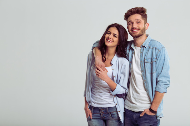Beautiful young couple in jeans - Fotó, kép