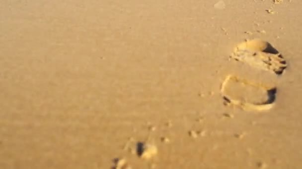 impressão da próxima bota na areia
 - Filmagem, Vídeo