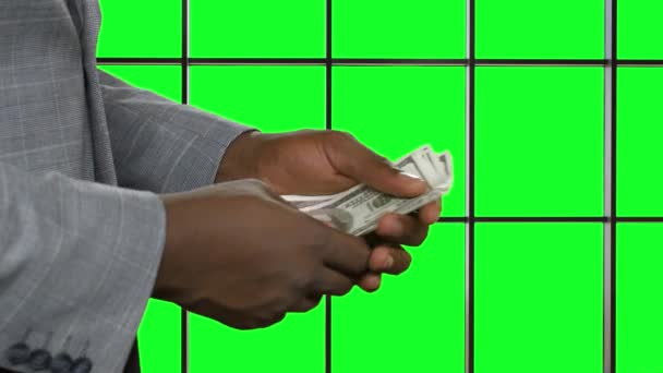 Afroamerican man counting money. - Footage, Video