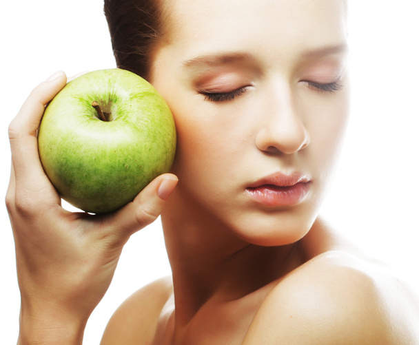 Tiro de cabeça de mulher segurando maçã
 - Foto, Imagem