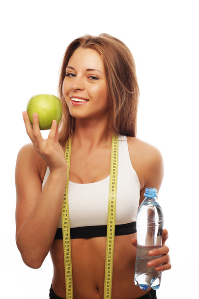 Healthy woman with water and apple diet smiling - Valokuva, kuva
