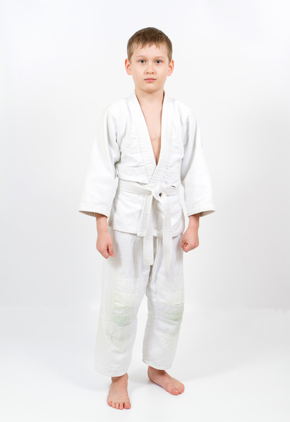 Karate boy in white kimono fighting - Photo, Image