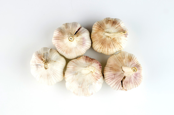 Top view of unshelled organic garlic heads - Photo, Image