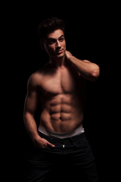muscular man posing with hand in pocket - Foto, afbeelding