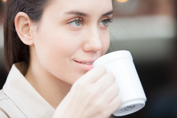 Pretty woman drinking coffee - Photo, Image