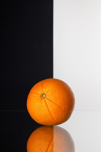 Single orange isolated on black and white background  - Φωτογραφία, εικόνα