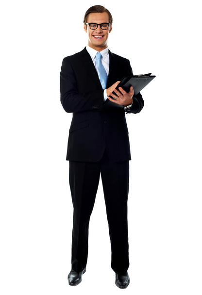 Full length view of relaxed businessman holding a folder - Foto, immagini