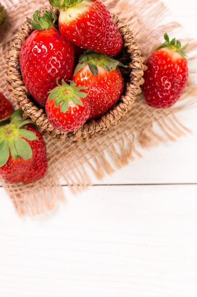 Ripe red strawberries on wooden table, healthy food - Foto, imagen