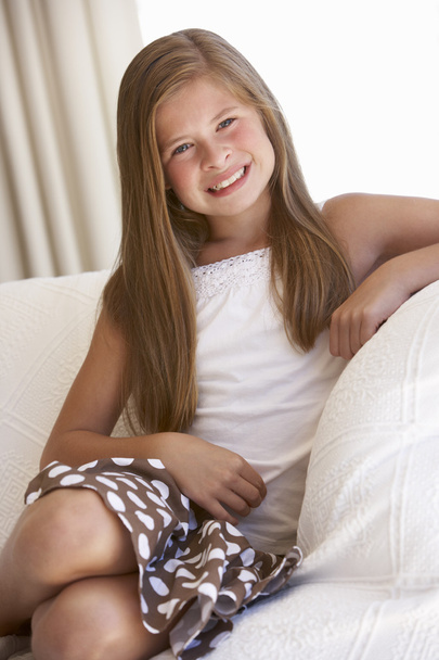 Young Girl Relaxing On Sofa  - Foto, afbeelding