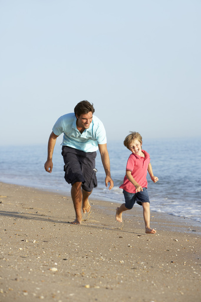 Father And Son Running Along Beach - Photo, Image