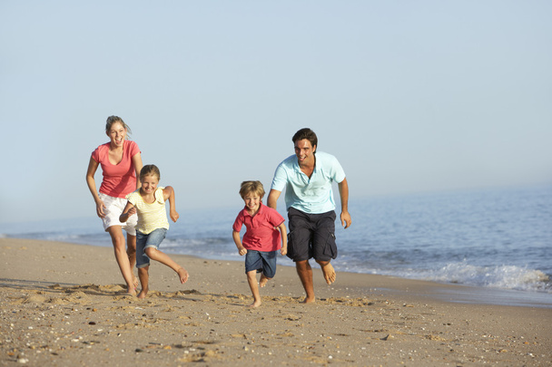 Family Running On Beach  - Foto, Bild
