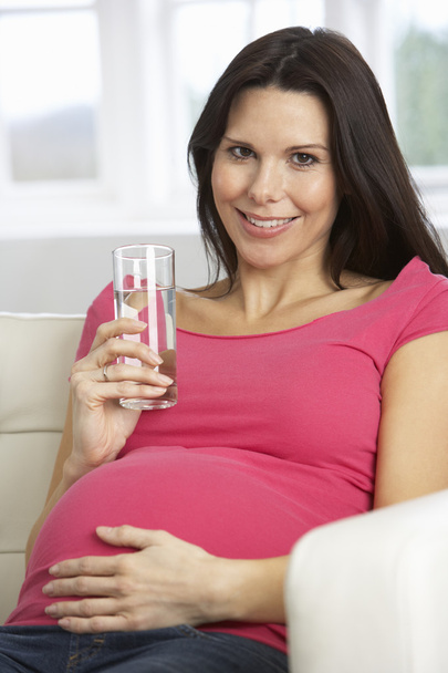 Pregnant Woman Drinking Glass Of Water  - Foto, afbeelding