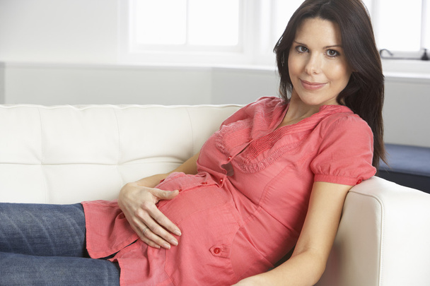 Pregnant Woman Relaxing At Home - Foto, Imagen