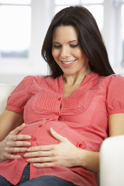 Pregnant Woman Relaxing At Home - Foto, imagen