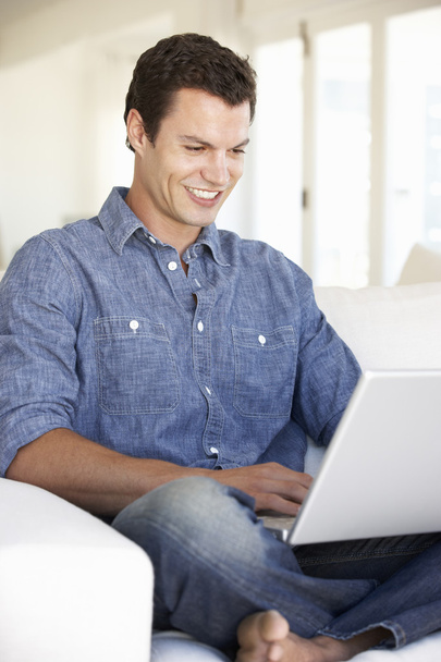 Man Using Laptop Computer At Home - Photo, Image