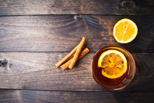 Cup of tea with lemon and cinnamon - Photo, Image