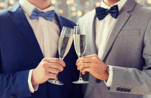 close up of male gay couple with champagne glasses - Фото, изображение