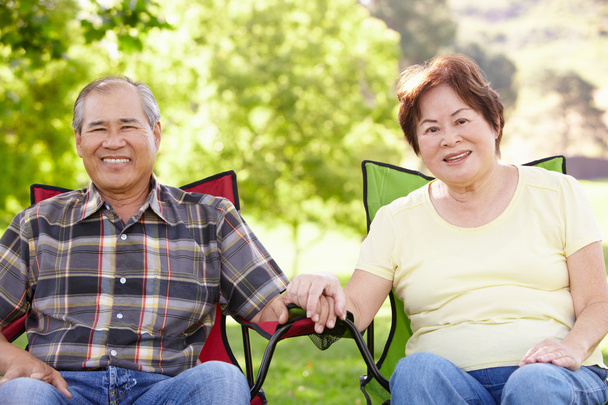 Senior couple sitting in the garden  - Foto, afbeelding