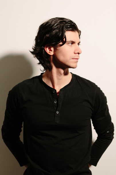 Young man in a black sweater. - Foto, Bild