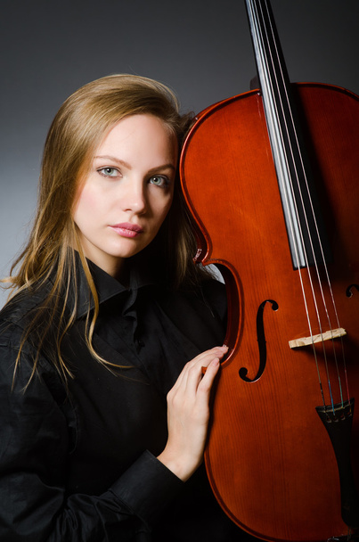 Young woman in musical concept - Fotó, kép