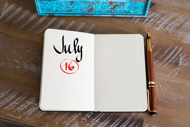 July 16 Calendar Day handwritten on notebook - Foto, Imagem