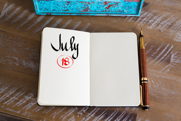 July 18 Calendar Day handwritten on notebook - Foto, Imagem