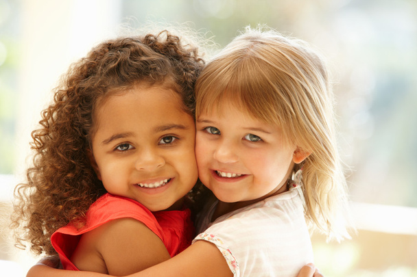Two little girls hugging - Фото, изображение