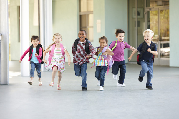 Group Of Schoolchildren Running Outside - Foto, imagen