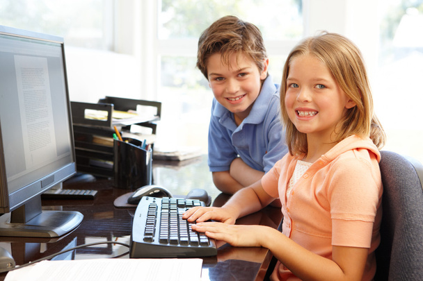 Young boy and girl using computer  - Φωτογραφία, εικόνα