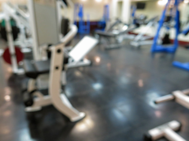 Abstract blurred image of interior athletic gym for fitness with bokeh background - Photo, image