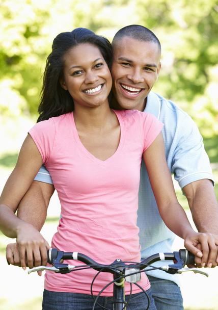 Young Couple Cycling In Park - Фото, изображение