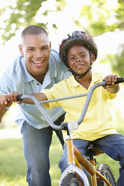 Father Teaching Son To Ride Bike - Фото, зображення