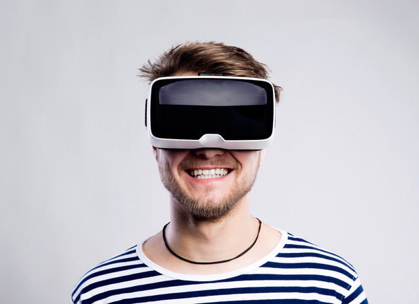 Man wearing virtual reality goggles. - Zdjęcie, obraz