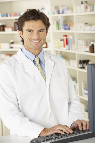 Pharmacist working in pharmacy - Фото, зображення
