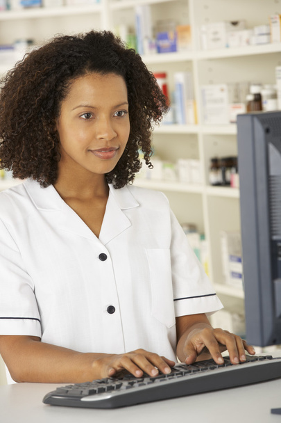 Nurse working on computer in pharmacy - Photo, image