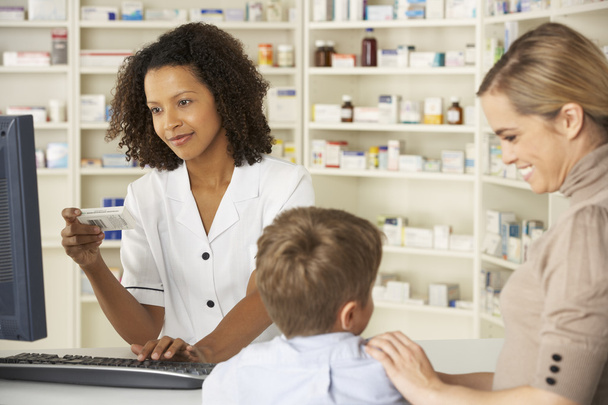 Pharmacist with mother and child - Photo, image