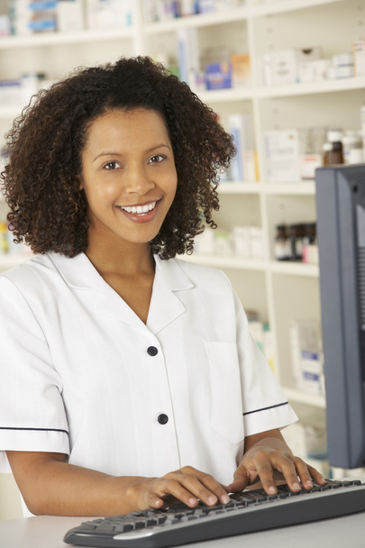 Nurse working on computer in pharmacy - Photo, image