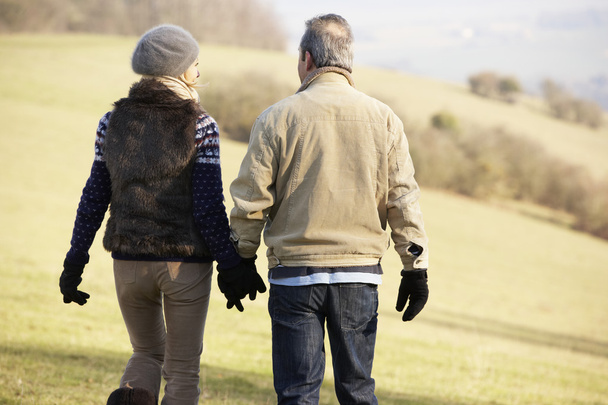 Mature couple on country walk - Fotó, kép